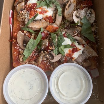 Ranch - Two slices  of The 4 Pizza and the Devine ranch dressing - Pizza Near Me - Portland, Oregon