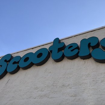 Scooters - a scooter's sign on the side of a building - American Near Me - Aurora, Colorado