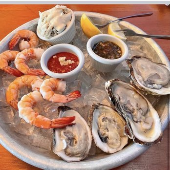 Blue Pointe Oyster Bar and Seafood Grill - a platter of oysters and shrimp - Seafood Near Me - Fort Myers, Florida