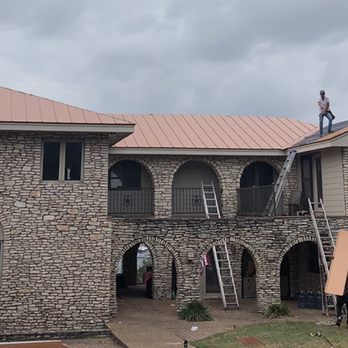 E4 Construction - Guys putting on the Standing Seam - General Contractors Near Me - Georgetown, Texas