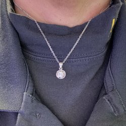 Benny's Jewelry & Repair - My Mom's wedding ring as a pendant.