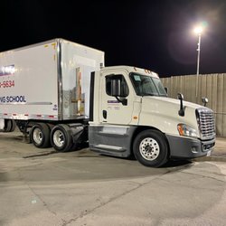 High Impact Truck Driving Academy - Night time High Impact Academy yard.