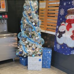 a christmas tree with a snowman decoration