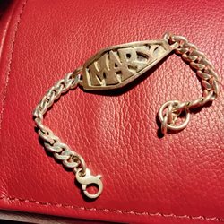 C Leslie Smith - My beloved I-D bracelet.  It replaced one previously lost.  I have several treasured pieces from the 60's forward.
