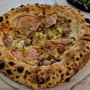 Pizza Art Wine - RUSTICA BURRATA, Roast pork, ham, rosemary Pistachio, finished With HONEY - Italian Near Me - Baton Rouge, Louisiana Pizza Art Wine - RUSTICA BURRATA, Roast pork, ham, rosemary Pistachio, finished With HONEY - Italian Near Me - Baton Rouge, Louisiana