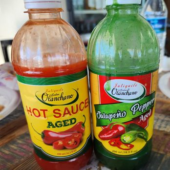 La Glorieta Honduran Restaurant - two bottles of hot sauce - Caribbean Near Me - Tucker, Georgia La Glorieta Honduran Restaurant - two bottles of hot sauce - Caribbean Near Me - Tucker, Georgia