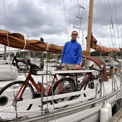 Olympic Coast Sailing Charters and Tours - Captain Tracy securing our bikes to the side rail.