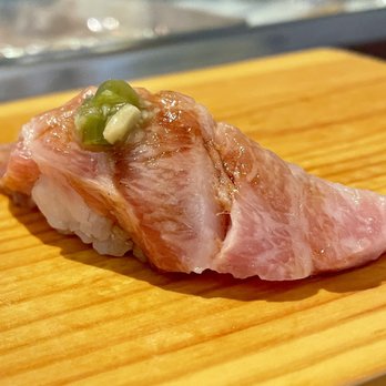 Hilo Beverly Hills - piece of sushi on a cutting board - Sushi Bars Near Me - Beverly Hills, California Hilo Beverly Hills - piece of sushi on a cutting board - Sushi Bars Near Me - Beverly Hills, California