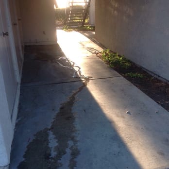 The Arbors - Water that is constantly draining where you walk up everyday. I wish they could use this for watering the plants to the right! - Apartments Near Me - Lake Forest, California