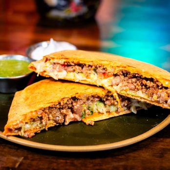 The Burrowing Owl - Crunchwrap cut in half - Lounges Near Me - Colorado Springs, Colorado The Burrowing Owl - Crunchwrap cut in half - Lounges Near Me - Colorado Springs, Colorado