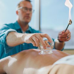 Whole Systems Healthcare - Dr. Spears performing cupping