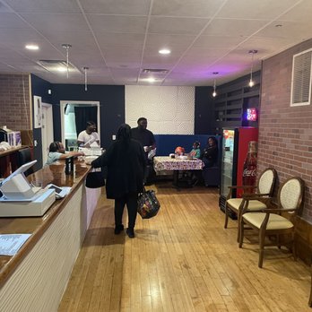 Poe's Kitchen - a woman standing in the kitchen - Soul Food Near Me - Bridgeport, Connecticut Poe's Kitchen - a woman standing in the kitchen - Soul Food Near Me - Bridgeport, Connecticut