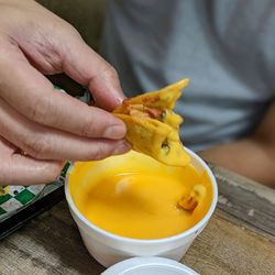 Habanero Grill - Taco dipping into side nacho cheese.