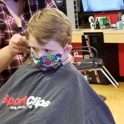 Great Clips - My kid getting hair cut at Sports Cuts.