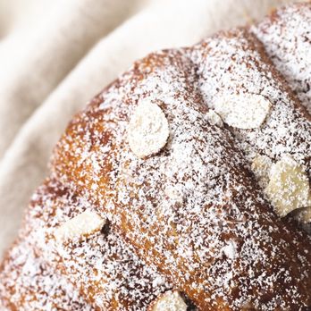 Central Kitchen Bakery - a pastry covered in powdered sugar - Bakeries Near Me - Corpus Christi, Texas