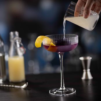 Eddie V's Prime Seafood - Our signature Hope Diamond Cocktail, featuring Grey Goose vodka, butterfly tea and a purple diamond ice cube - Seafood Near Me - Troy, Michigan Eddie V's Prime Seafood - Our signature Hope Diamond Cocktail, featuring Grey Goose vodka, butterfly tea and a purple diamond ice cube - Seafood Near Me - Troy, Michigan