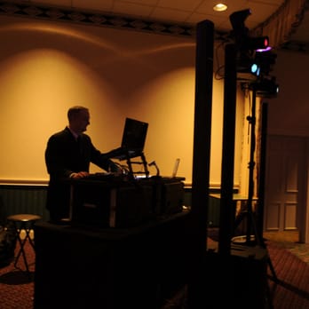 DJ Todd Entertainment - a man in a dark room - DJs Near Me