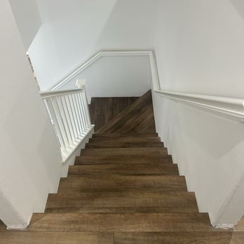Southland Carpet - New luxury vinyl plank flooring on staircase looking from the top, downward. - Carpeting Near Me - Wildomar, California