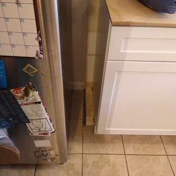 Tri-Pups - a kitchen with a refrigerator and a dishwasher - Handyman Near Me - Southfield, Michigan