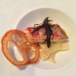 Rouget with artichokes and tomato chip. Rouget with artichokes and tomato chip.