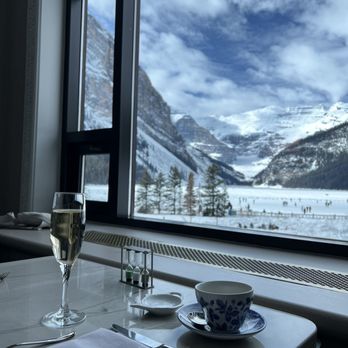 FAIRVIEW BAR AND RESTAURANT - Glass of Canadian sparkling wine and the beautiful view! - Modern European Near Me - Lake Louise, Alberta FAIRVIEW BAR AND RESTAURANT - Glass of Canadian sparkling wine and the beautiful view! - Modern European Near Me - Lake Louise, Alberta