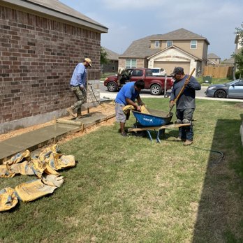 Brothers Landscaping - two men working in a yard - Landscaping Near Me Brothers Landscaping - two men working in a yard - Landscaping Near Me