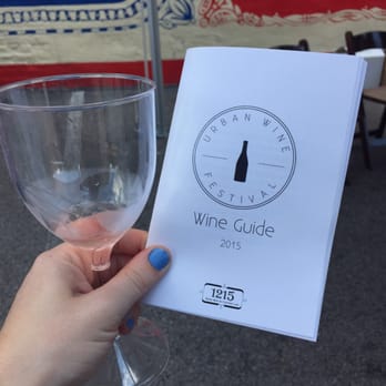 Urban Wine Festival - a person holding a wine glass - Wine Bars Near Me - Cincinnati, Ohio Urban Wine Festival - a person holding a wine glass - Wine Bars Near Me - Cincinnati, Ohio