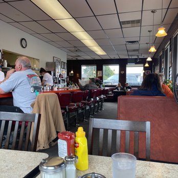 Starting Gate Restaurant - a man sitting at a table - Diners Near Me - Auburn, Washington Starting Gate Restaurant - a man sitting at a table - Diners Near Me - Auburn, Washington
