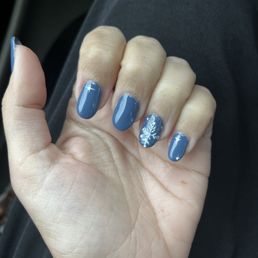 Gel nails with snowflake design Gel nails with snowflake design