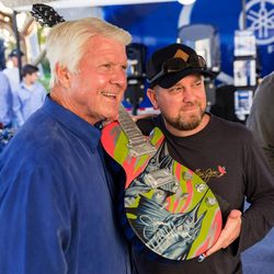 Dennis Friel hand paints a guitar for charity in Jimmy Johnson's tournament every year.
