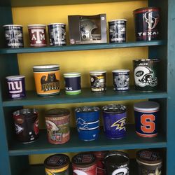 Texas Goody's Popcorn & Treats - Wall of sports tins!