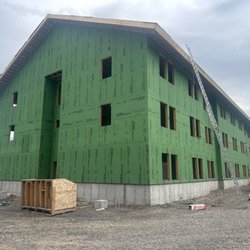 Big Sky Exterior Designs and Bath Solutions - Getting ready to side an employee dormitory at the Old Faith Lodge in Yellowstone National Park.