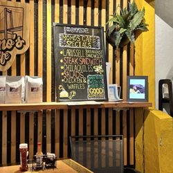 Momo's Cafe - A bit of the decor and the specials.  Also there is a tablet displaying various social media videos.