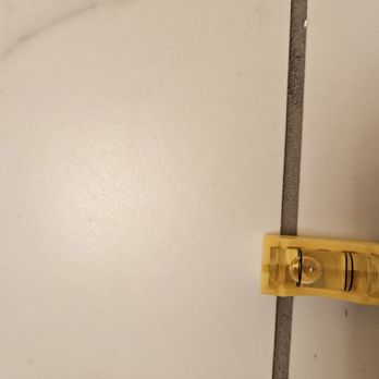 KJ Natural Stone - Forgivr the tilted pictures but I couldn't straighten them.  It isn't because it is on the grout line either.  Further up it slopes more. - Flooring Near Me - Raleigh, North Carolina