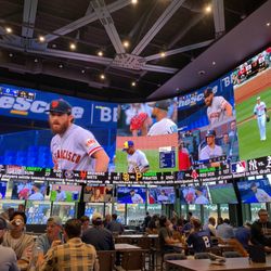 DraftKings Sportsbook at Wrigley Field - TV and bar setup