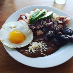 Beefcake - Red enchiladas,fried egg,refried beans, avocado and steak