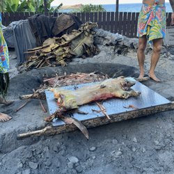 Roasted pig cooked underground