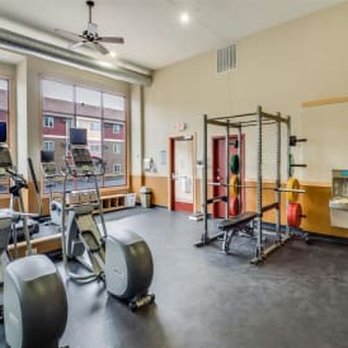 Campus Park - The gym with weights and equipment in a room with windows - Apartments Near Me - Duluth, Minnesota Campus Park - The gym with weights and equipment in a room with windows - Apartments Near Me - Duluth, Minnesota