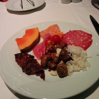 Fogo de Chão - Salad bar fruits, salami, mushrooms, rice, and bacon. - Brazilian Near Me - Austin, Texas Fogo de Chão - Salad bar fruits, salami, mushrooms, rice, and bacon. - Brazilian Near Me - Austin, Texas
