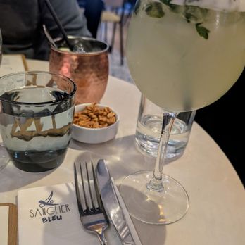 Le Sanglier Bleu - Gin-basil smash cocktail and Moscow mule in the back - French Near Me - Paris, 75 Le Sanglier Bleu - Gin-basil smash cocktail and Moscow mule in the back - French Near Me - Paris, 75