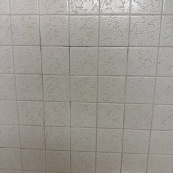 Soldotna Inn - Grout after simple wipe with water and washcloth - still not clean but showing how a little effort would make a big improvement.