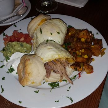 Santa Fe - 2 southern biscuits with pulled pork and chorizo topped with eggs - Latin American Near Me - New Orleans, Louisiana Santa Fe - 2 southern biscuits with pulled pork and chorizo topped with eggs - Latin American Near Me - New Orleans, Louisiana