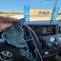 Walmart Supercenter - Grocery pickup is the best.  Knitting while I wait