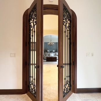 Betts Fine Carpentry & Remodeling - Custom arched french doors leading to home office. - Carpenters Near Me