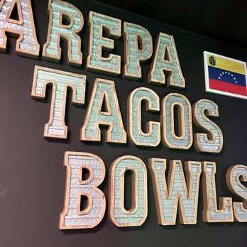 Latin Arepas - a sign that says arepa tacos bowls - Venezuelan Near Me - Springboro, Ohio