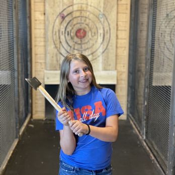 Dueling Axes - a girl holding a baseball bat - Axe Throwing Near Me - Columbus, Ohio