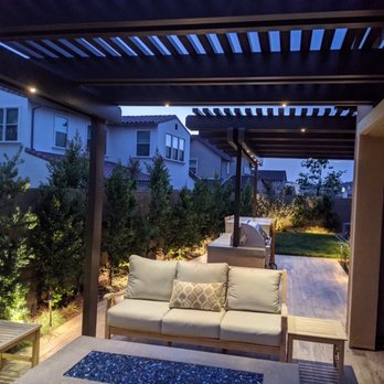 Scancelli Landscapes - Looking over firepit to rest of back yard, with California room to the right - Landscaping Near Me Scancelli Landscapes - Looking over firepit to rest of back yard, with California room to the right - Landscaping Near Me