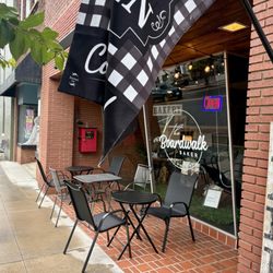 The Boardwalk Baker Downtown - Exterior with a few outdoor tables to enjoy downtown on a pleasant day