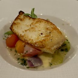 Halibut in a seafood herb broth with seasonal veg