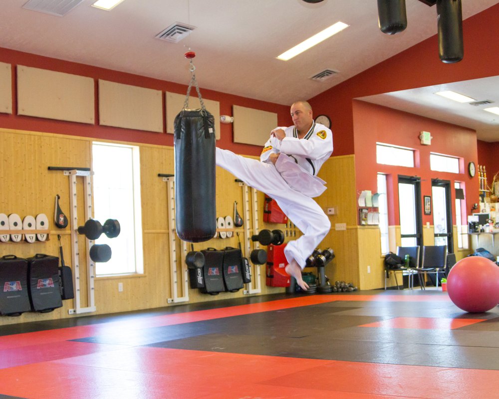 John Schiebout's Black Belt Academy Logo